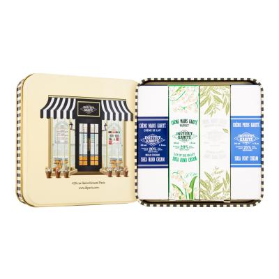 Institut Karité IKP Shop Pacco regalo crema mani Shea Hand Cream Lily Of The Valley 30 ml + crema mani Light Hand Cream Verbena & Shea 30 ml + crema mani Shea Hand Cream Milk Cream 30 ml + crema per i piedi Shea Foot Cream 30 ml + scatola di latta